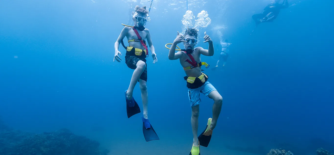 Two Boys SNUBA Diving Underwater on a Maui Snorkeling Cruise