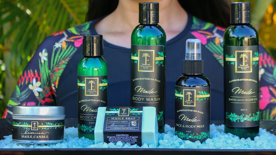 Woman Holding Tray of Island Essence Products