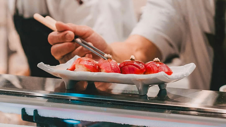Chef Preparing Sushi at Hachi by Oao