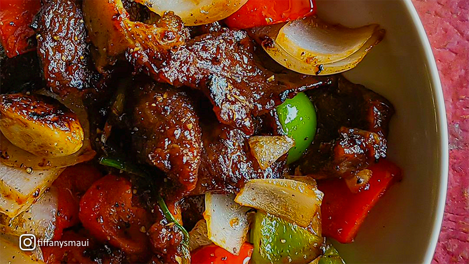 A close-up shot of meat and vegetables dish at Tiffany's in Maui