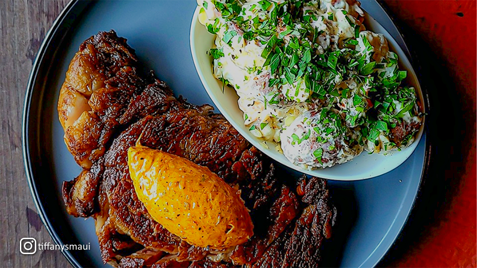 Delicious cuisine showing meat and side dish at Tiffany's Maui in Wailuku