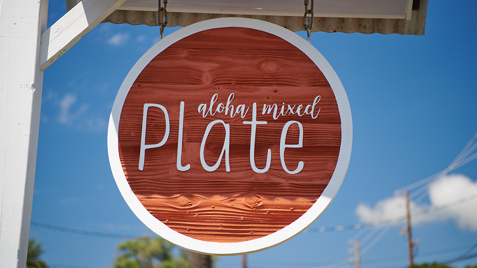 Hanging Aloha Mixed Plate restaurant sign in Lahaina, Maui