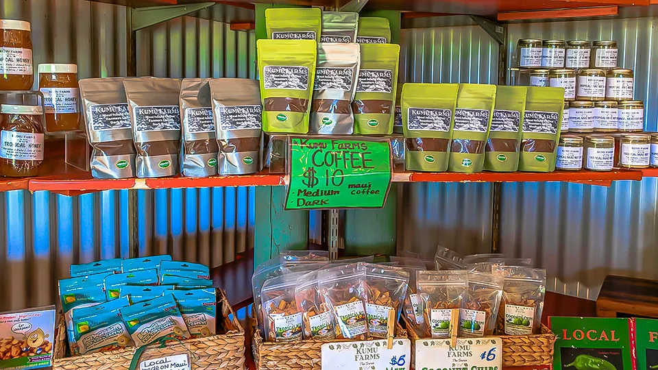 Display of Maui-grown coffee, spices, and organic packaged goods at a local Kumu Farms in Hawaii.