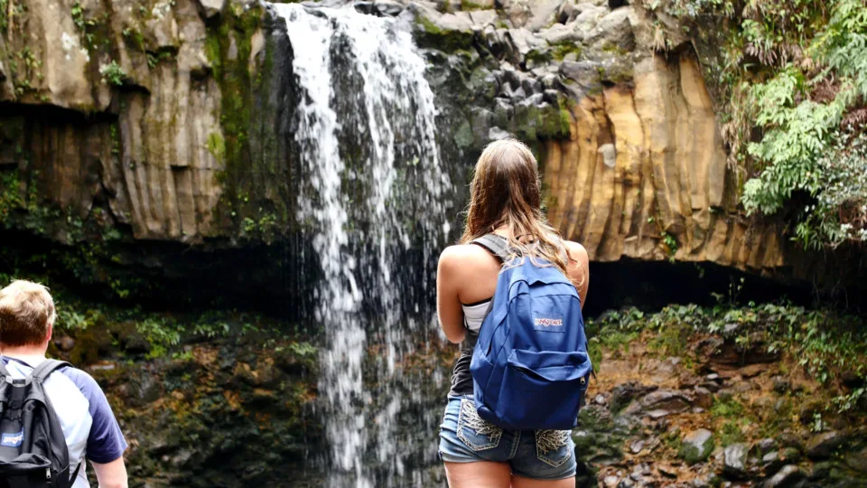 Hikers at Maui Waterfall