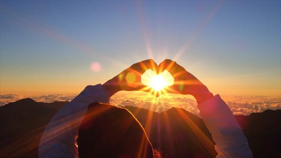 Hands Making a Heart Over the Sunset at Haleakala