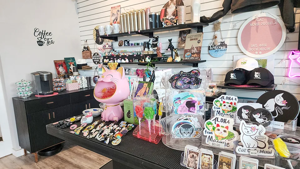 Cat Cafe Maui merchandise display featuring cat-themed gifts, souvenirs, and locally made products in Kahului