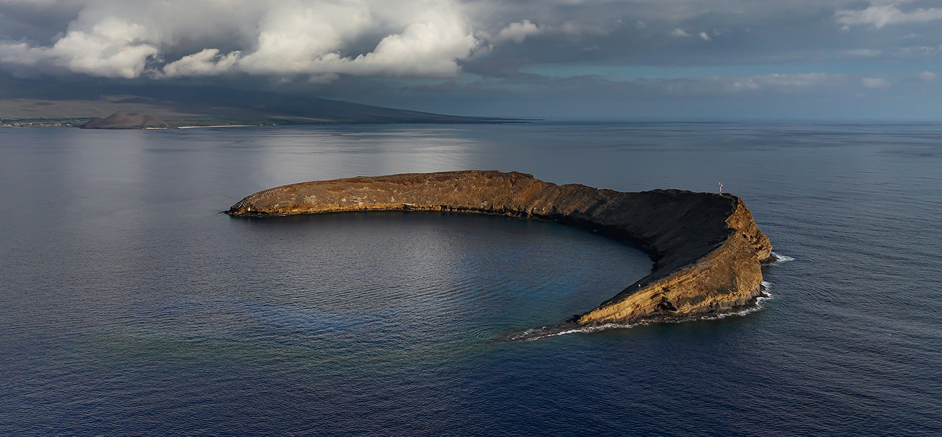 Calm morning conditions inside Molokini Crater with clear water and light wind