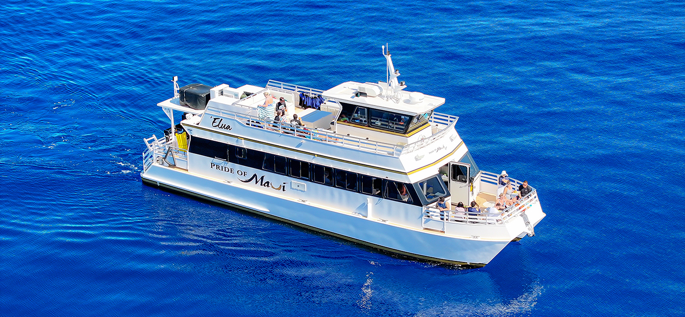 Snorkel tour boat in calm to lightly textured ocean conditions off Maui