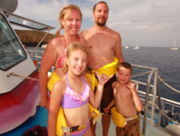 Family of four on the Pride of Maui boat.